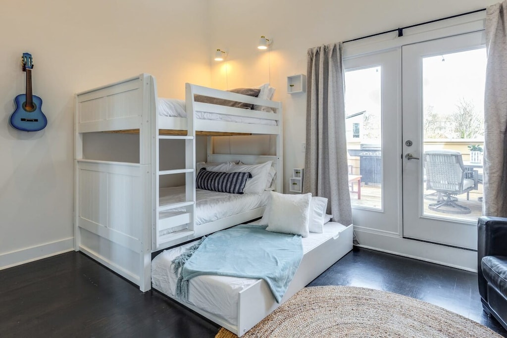 The top floor bedroom features cozy full bunk beds and a convenient trundle bed!