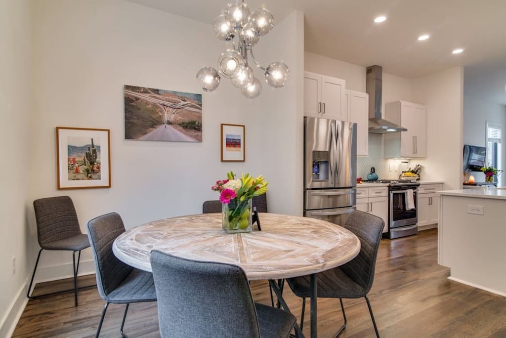 Dining area with an abundance of chairs for gathering around the table!