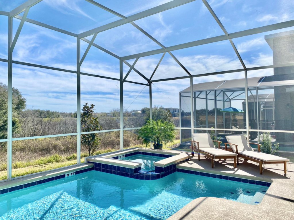 Private pool area, launge chairs and patio furniture