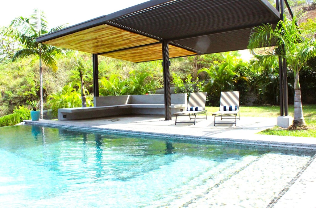 Shaded, pool-side area to relax, practice yoga, or watch sunset.