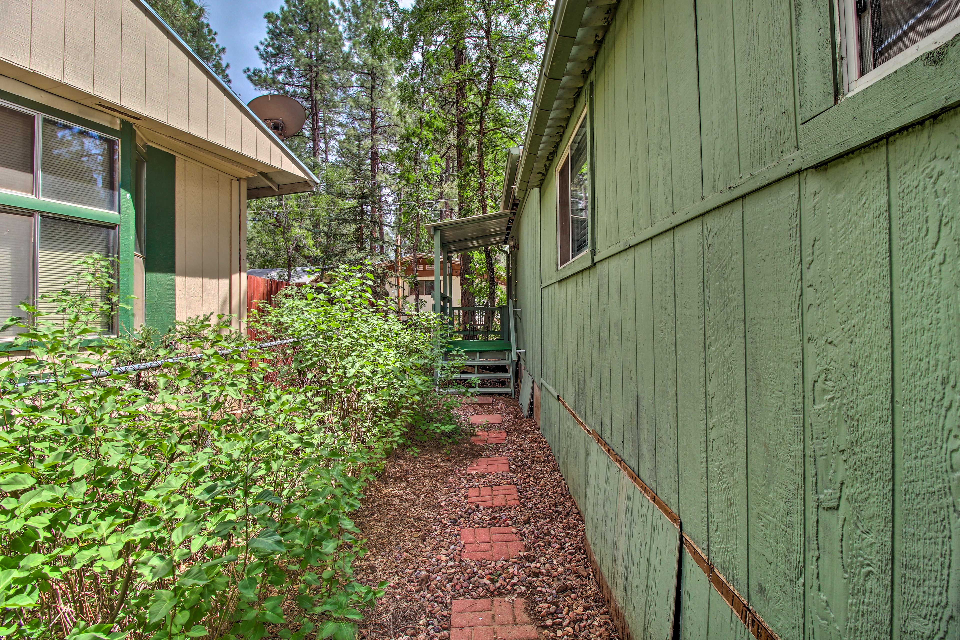 2 Mi to Rainbow Lake: Woodsy Retreat w/ Deck!
