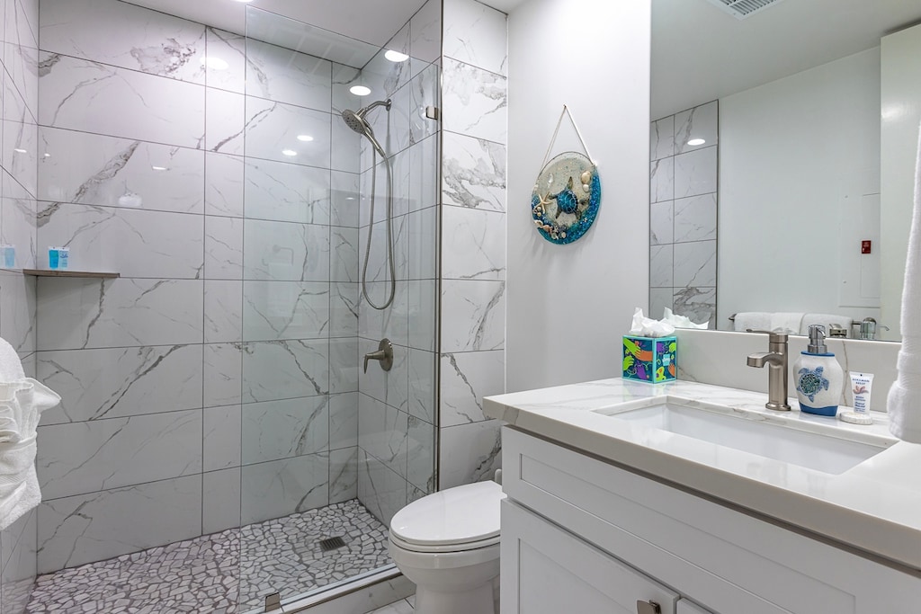Guest bathroom has a walk in shower