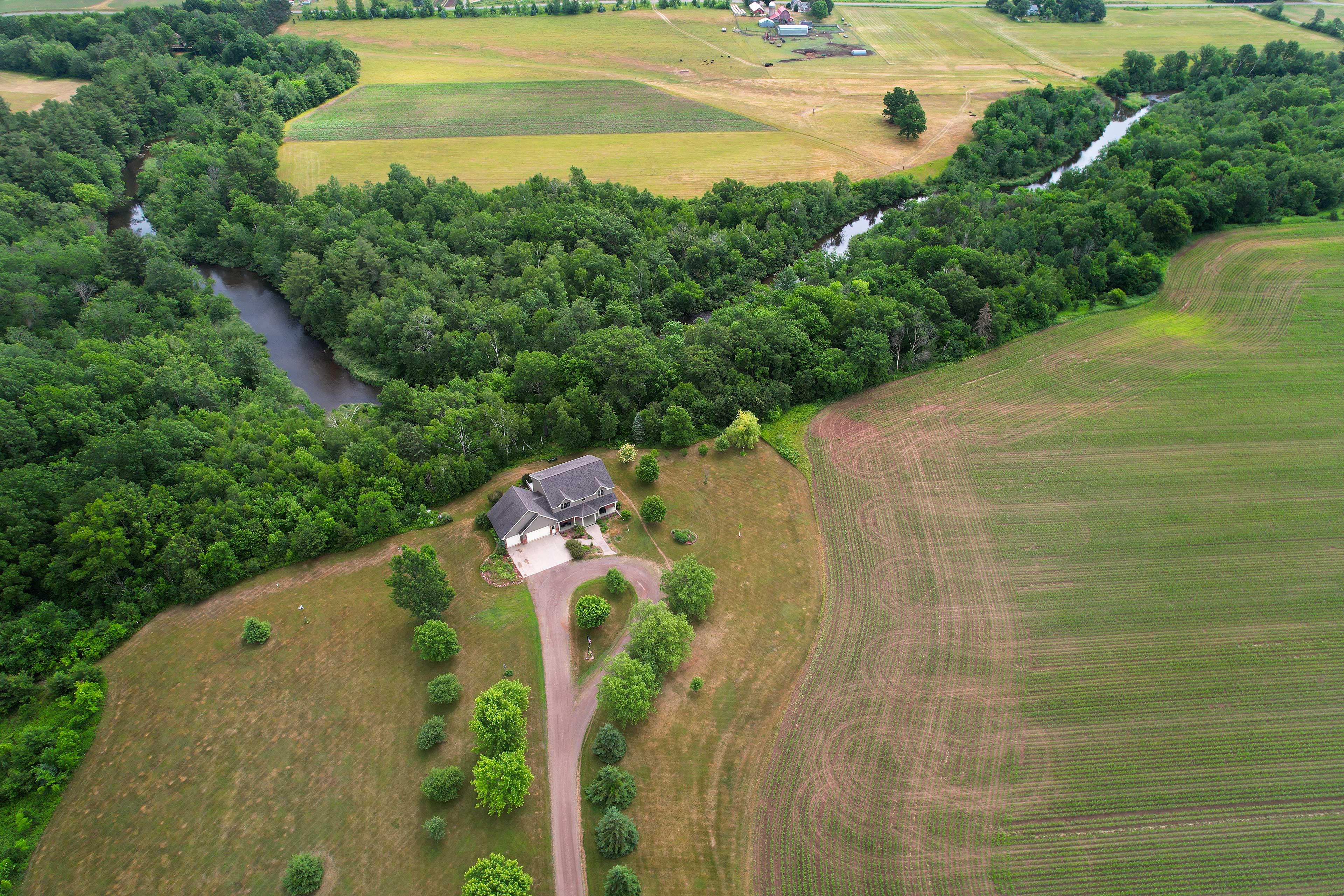 Property Image 2 - Riverfront Bliss in Rice Lake: Deck, Grill & Hike!