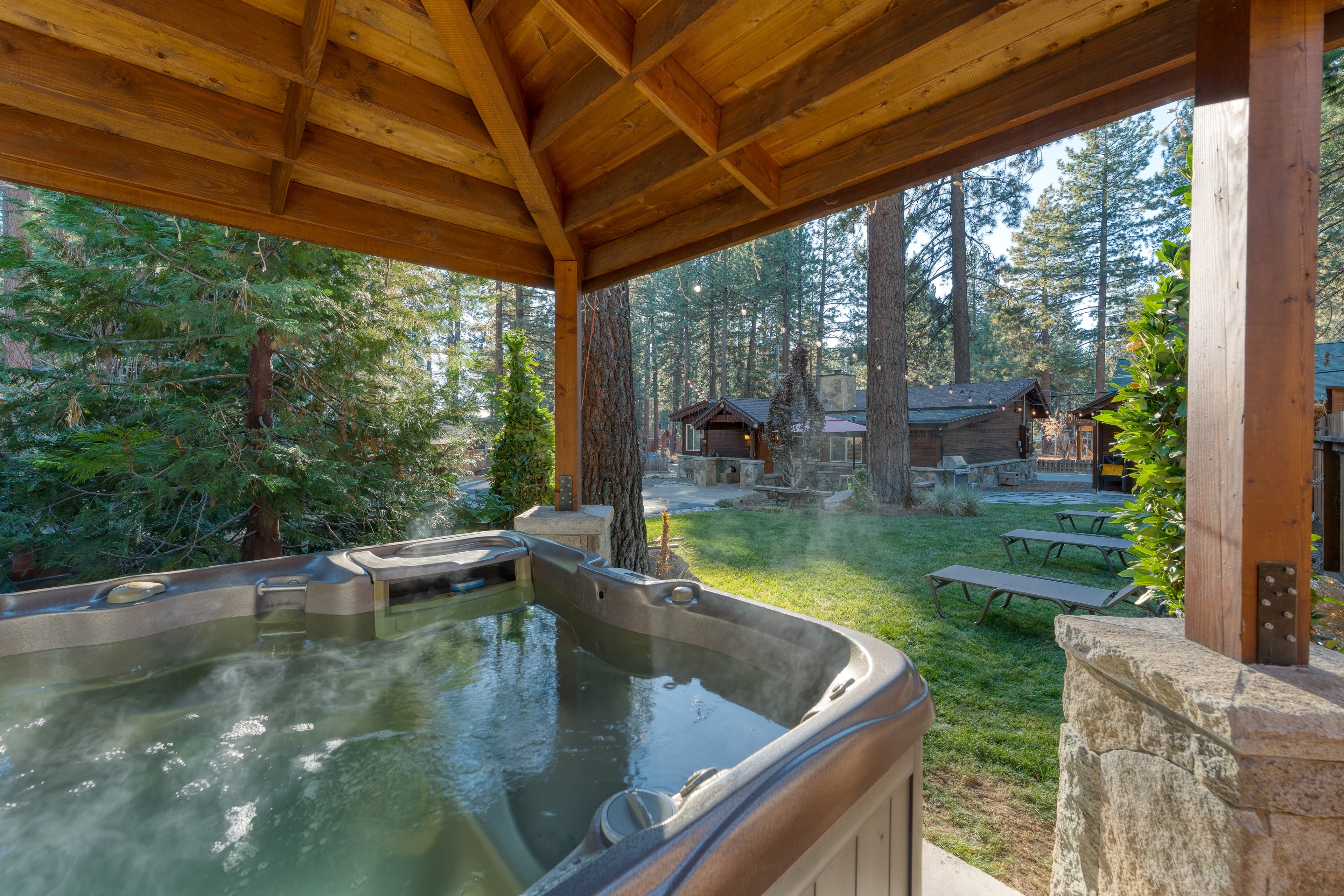 Private hot tub under a gazebo.