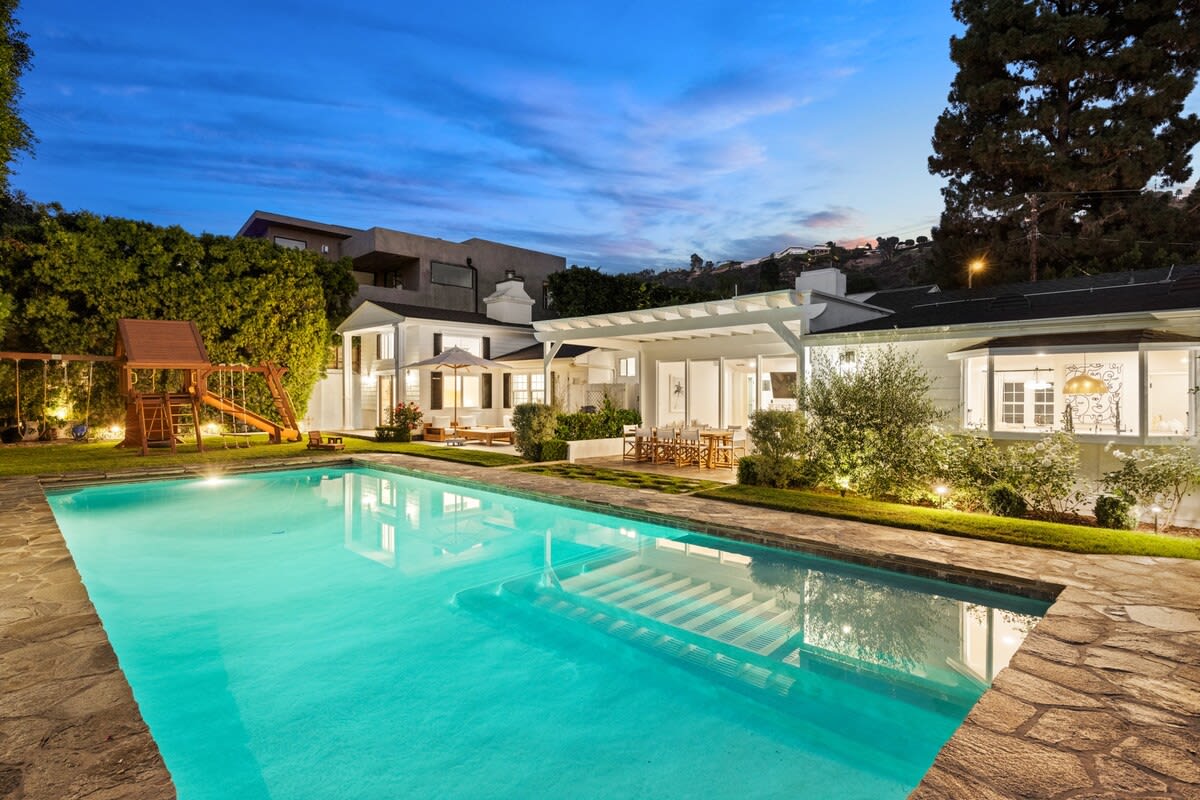 Twilight magic at our stunning pool—your Beverly Hills retreat awaits.