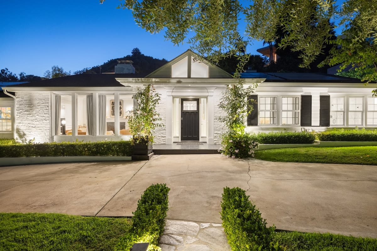 Approach the front of the house, where luxury meets serenity in this exclusive Beverly Hills estate.