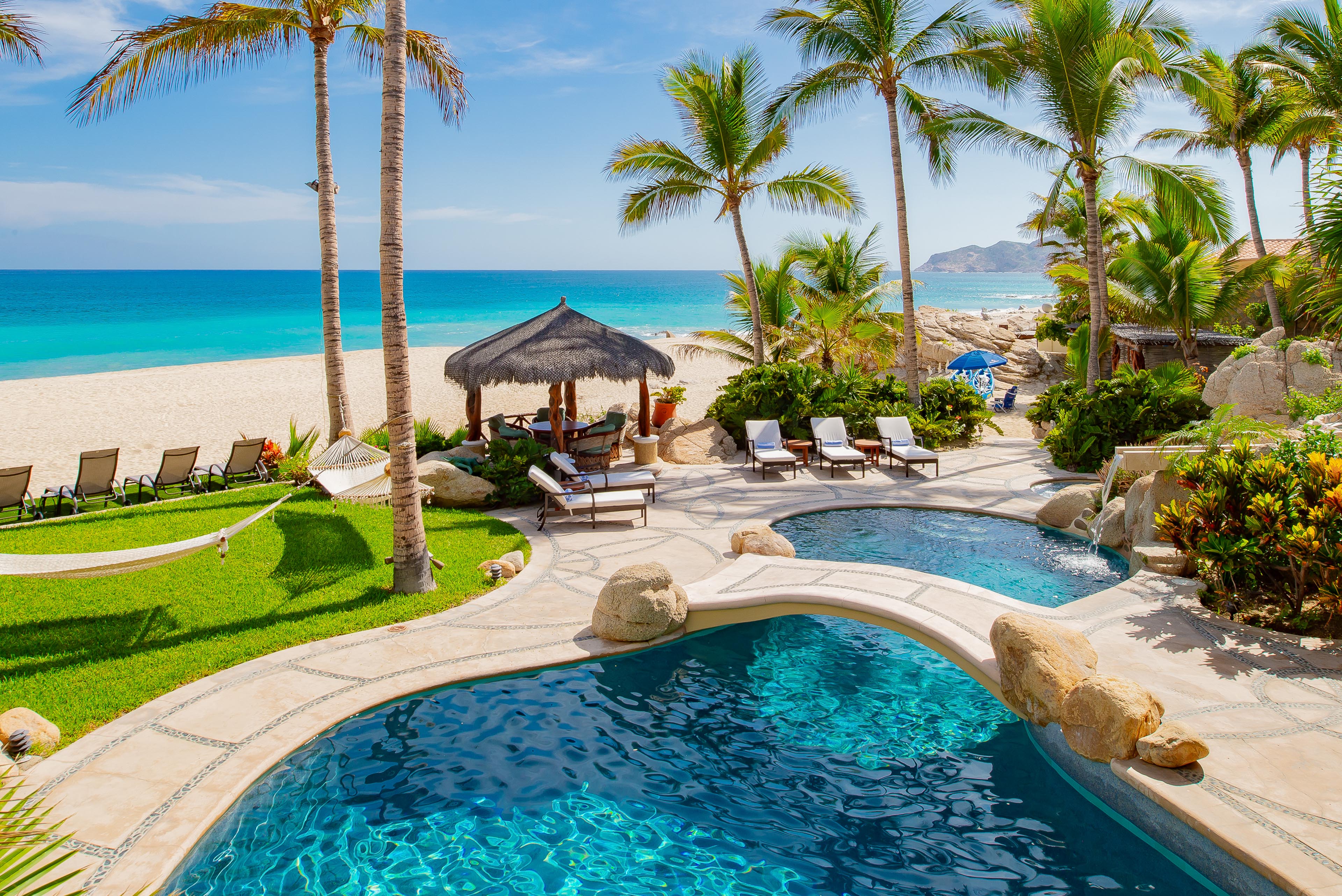 Patio with pool and beach view