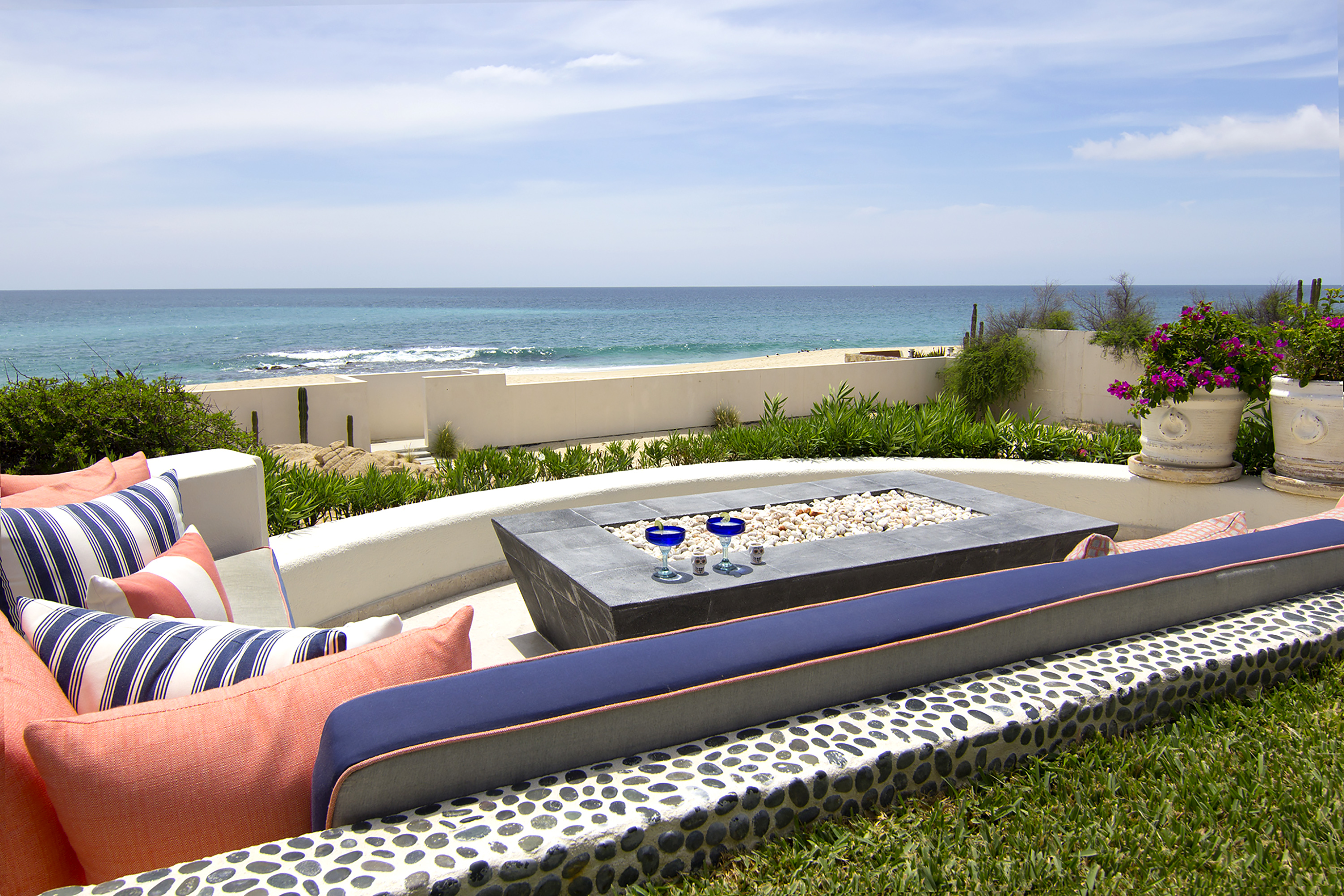 Patio with firepit and an beachfront view