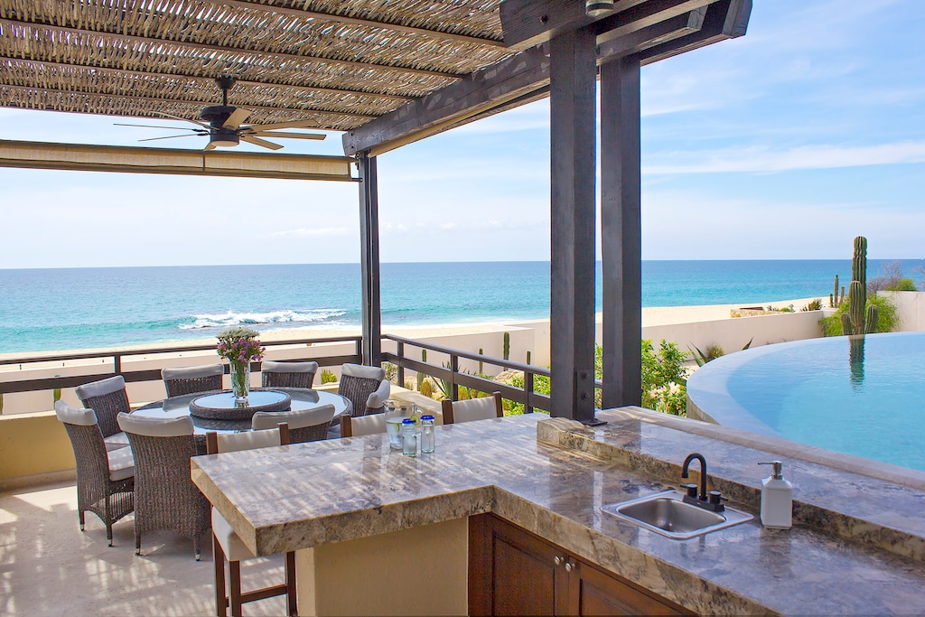 Outdoor dining with beachfront view