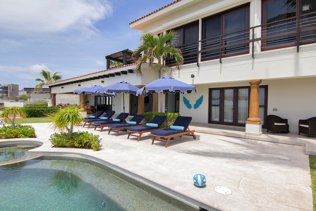 Poolside view with lounge chairs