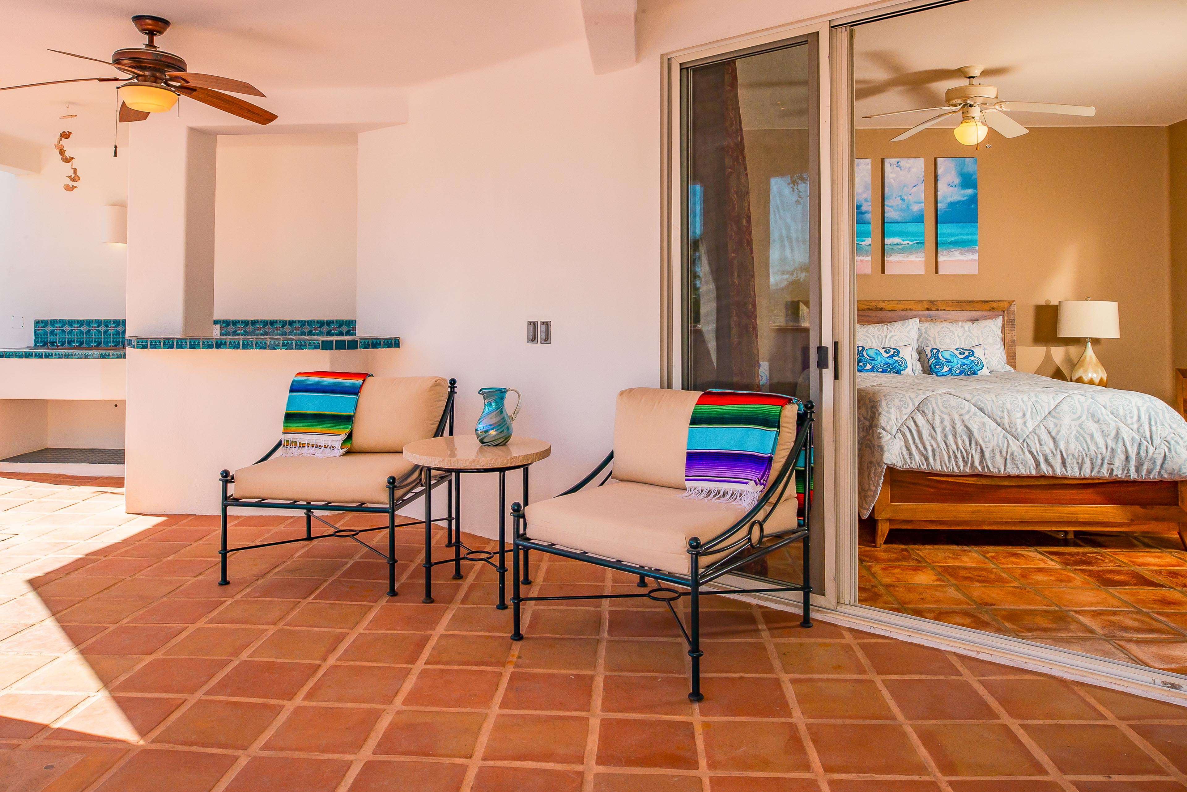 Suite with king bed and door to patio