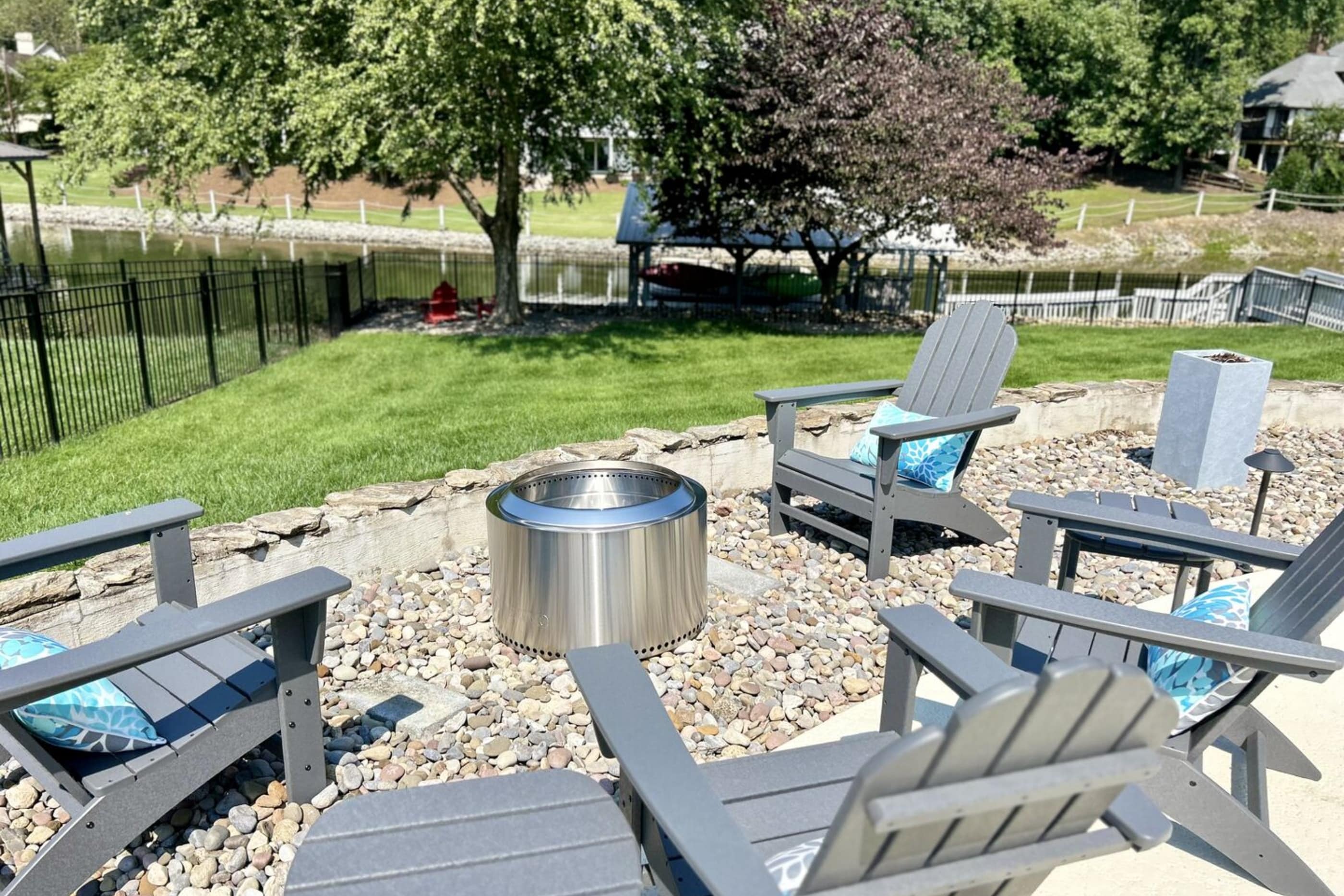 Gather 'round the fire pit in these cozy Adirondack chairs.