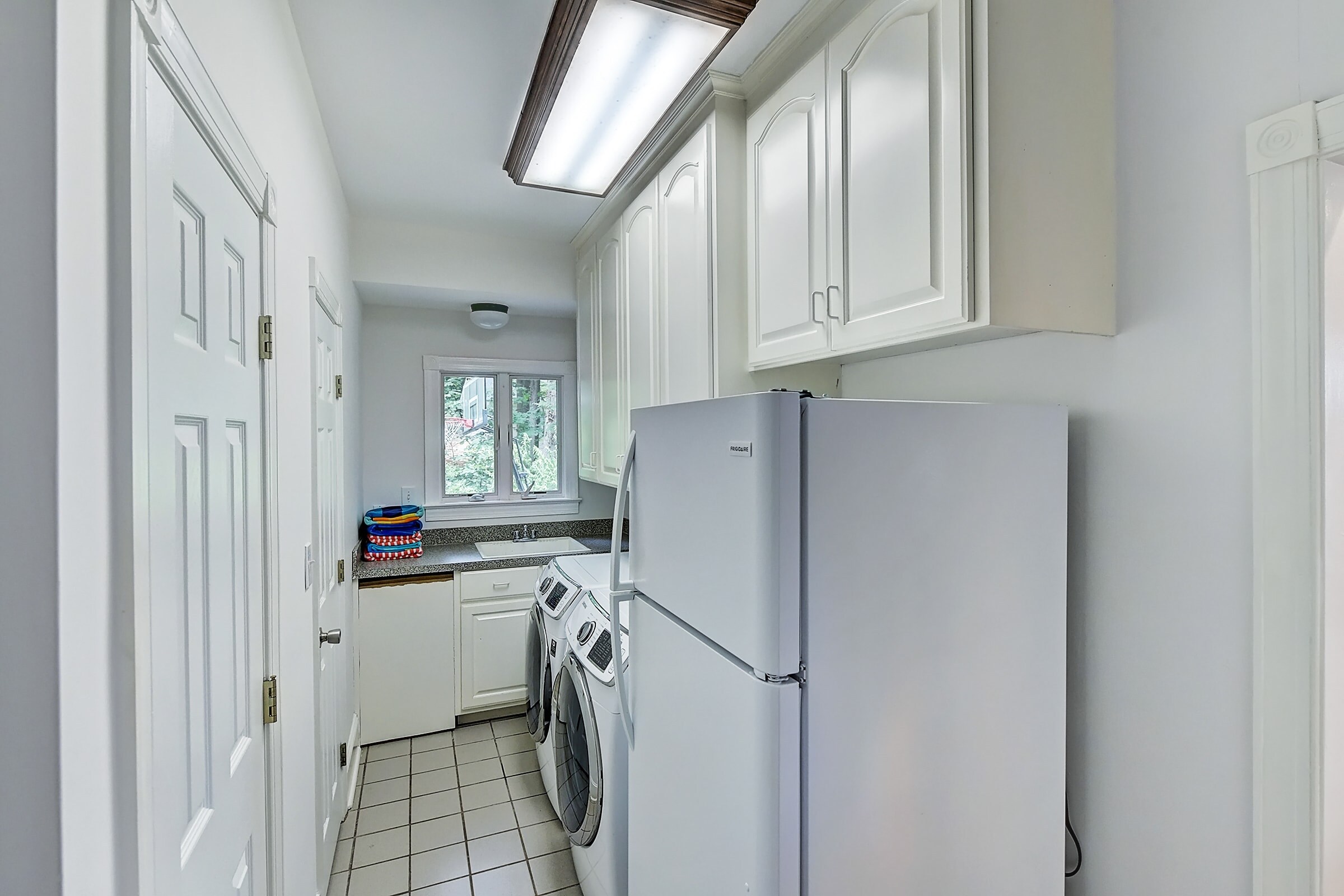 Main level-Laundry room with a washer and dryer.
