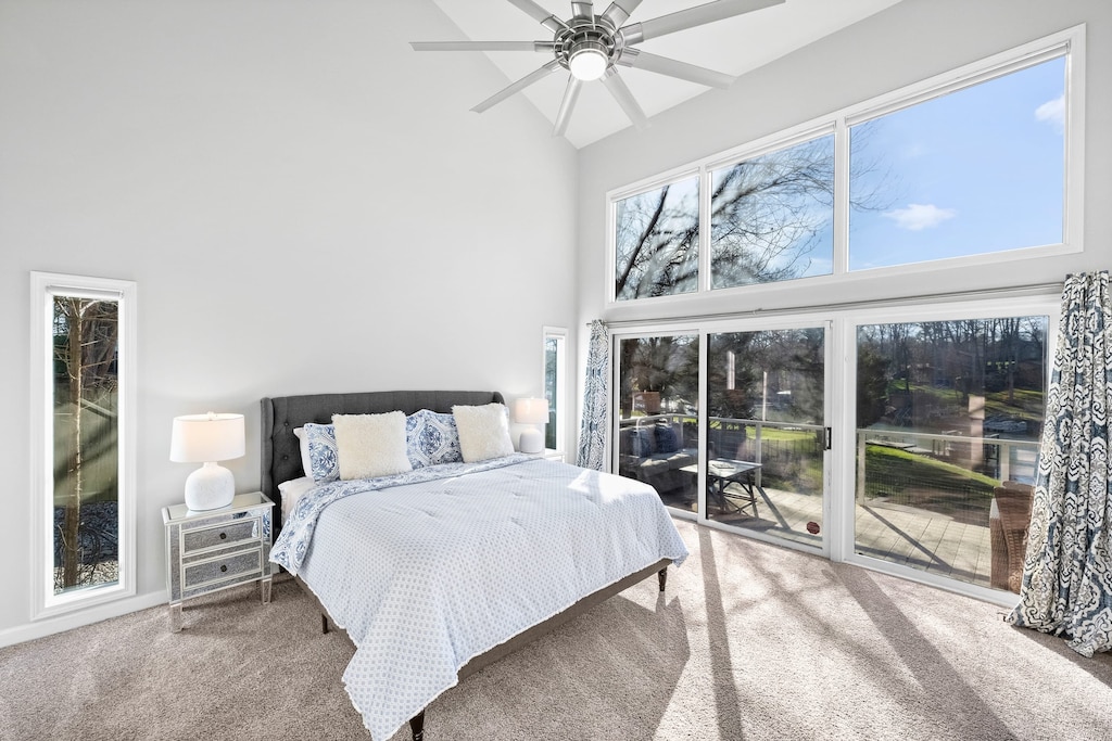 Main-level master bedroom with private sliding doors to the main deck & en suite bathroom. 