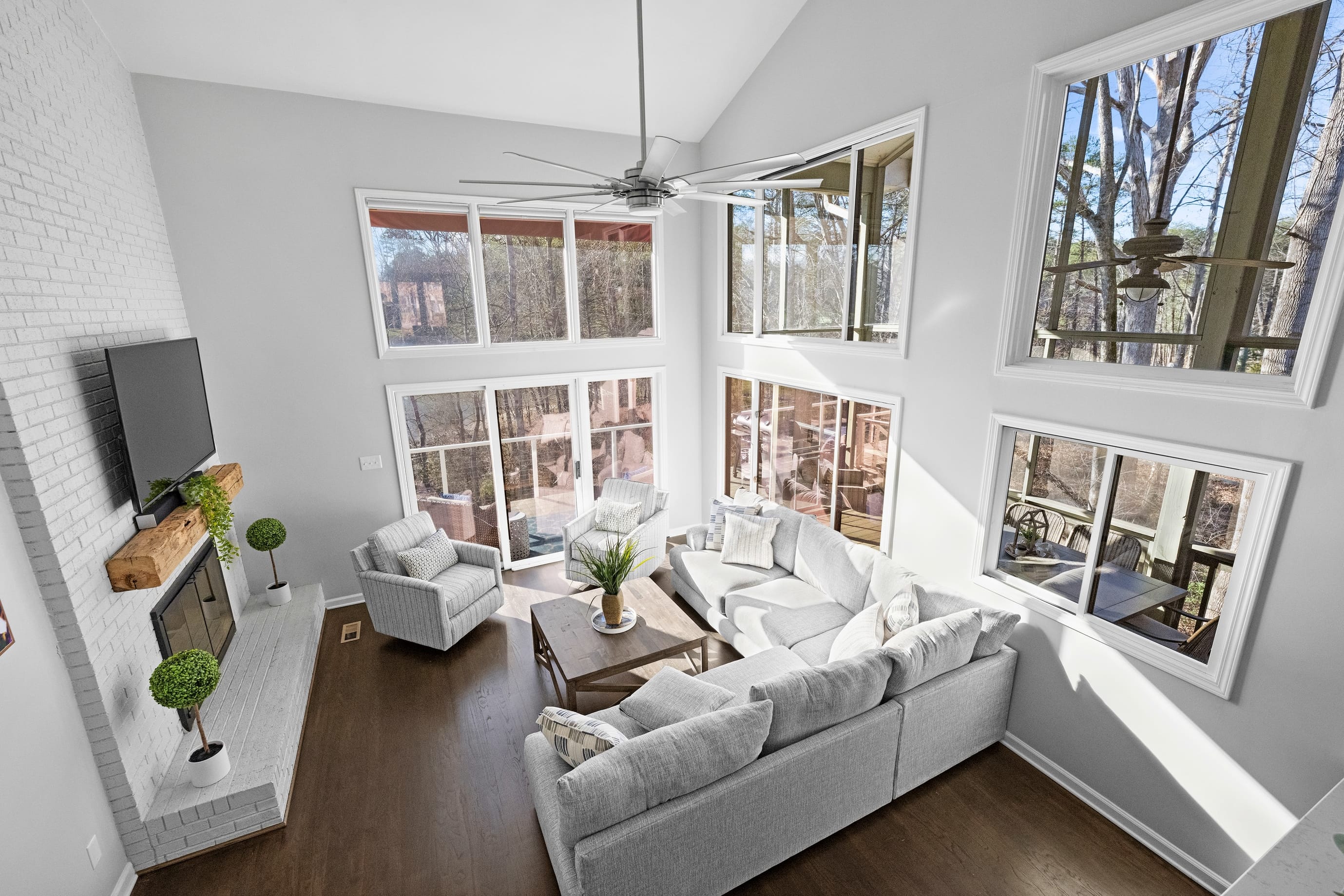 Main level family room with cozy sectional, TV, sliders to deck & wet bar.