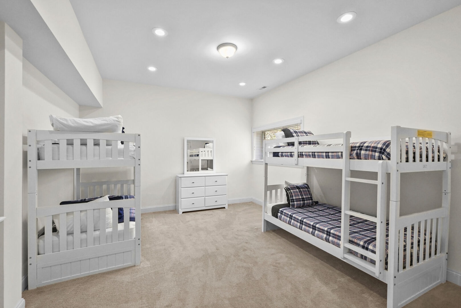 Lover level bunk rom with two sets of twin bunk beds. 