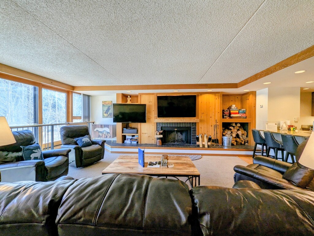 Cozy up by the electric fireplace and watch your favorite program!