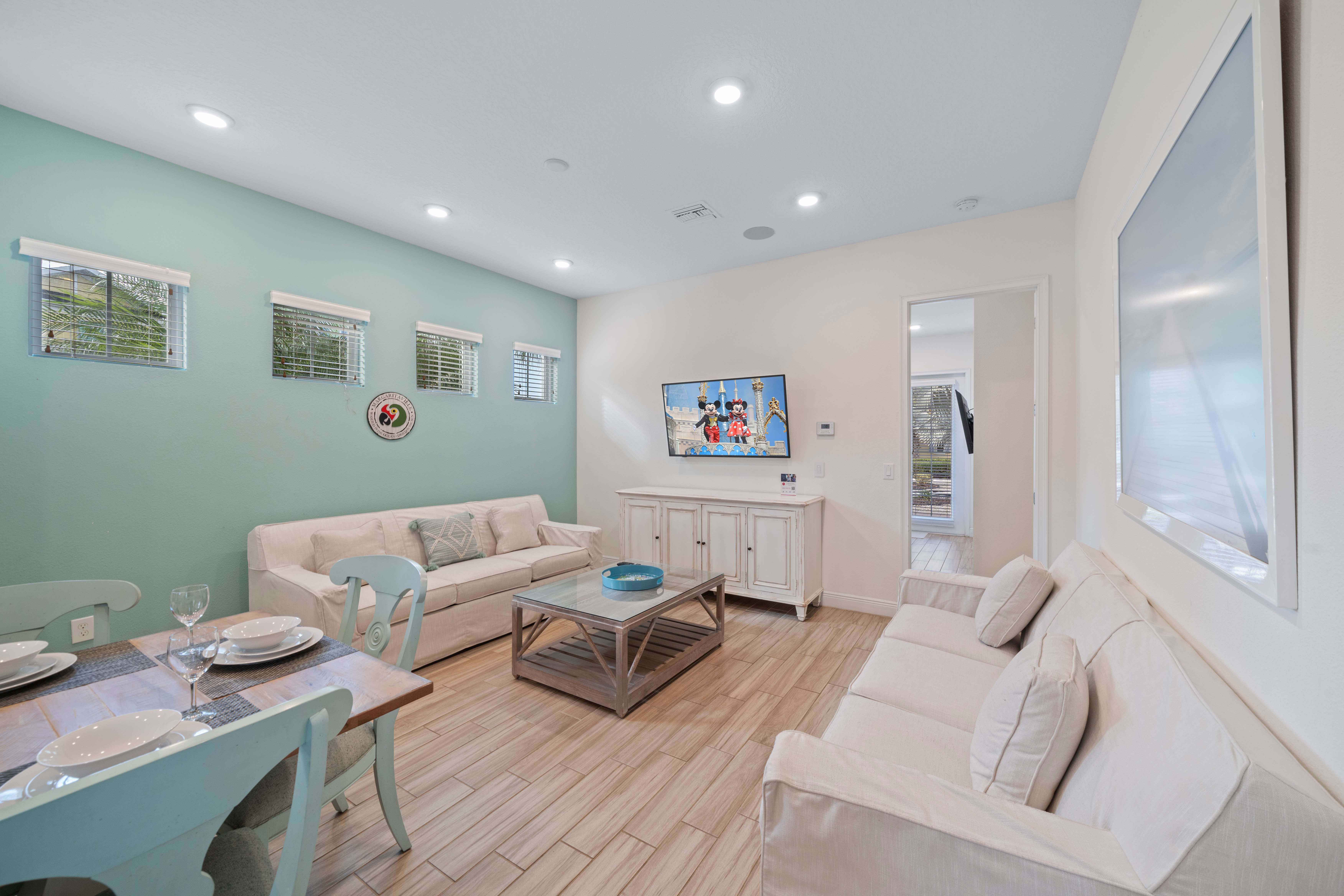 - Welcoming living area  of the townhouse in Kissimmee Florida - Experience comfort and convenience at the  living area - Entertainment meets relaxation, and every moment is effortlessly enjoyable
