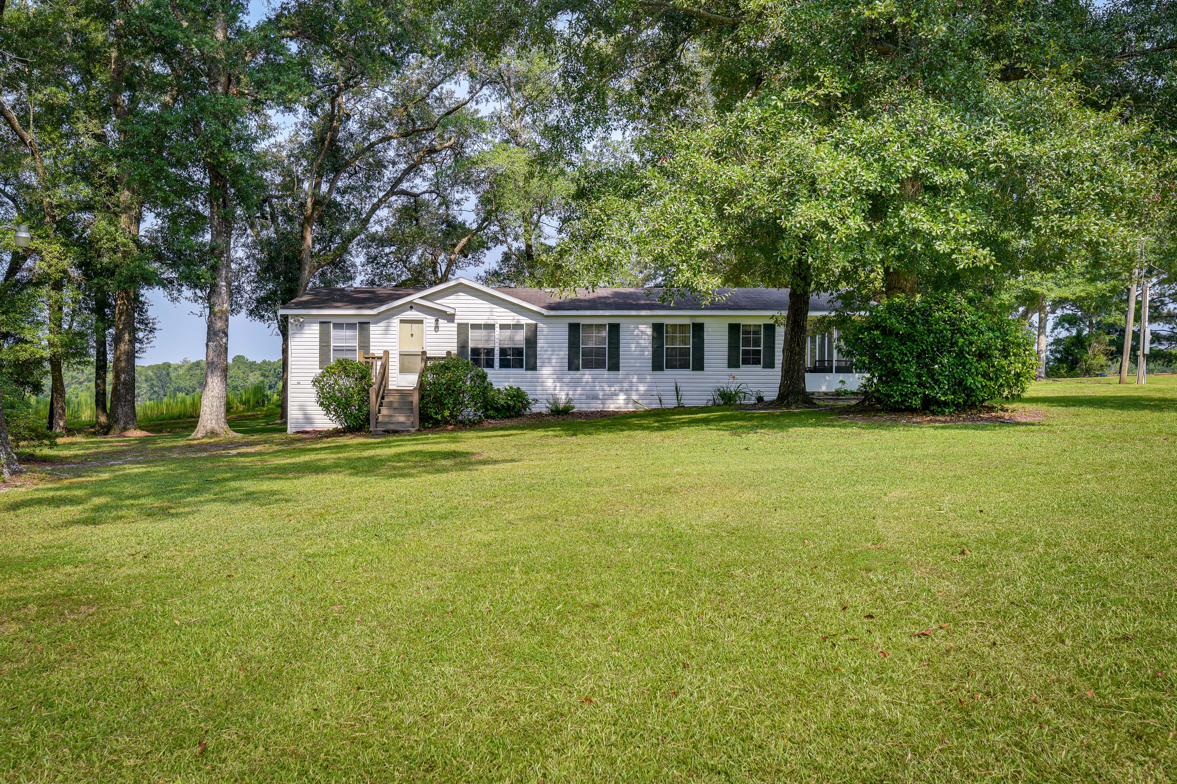 Property Image 2 - Sunny Florida Escape w/ Screened-In Patio & Grill!