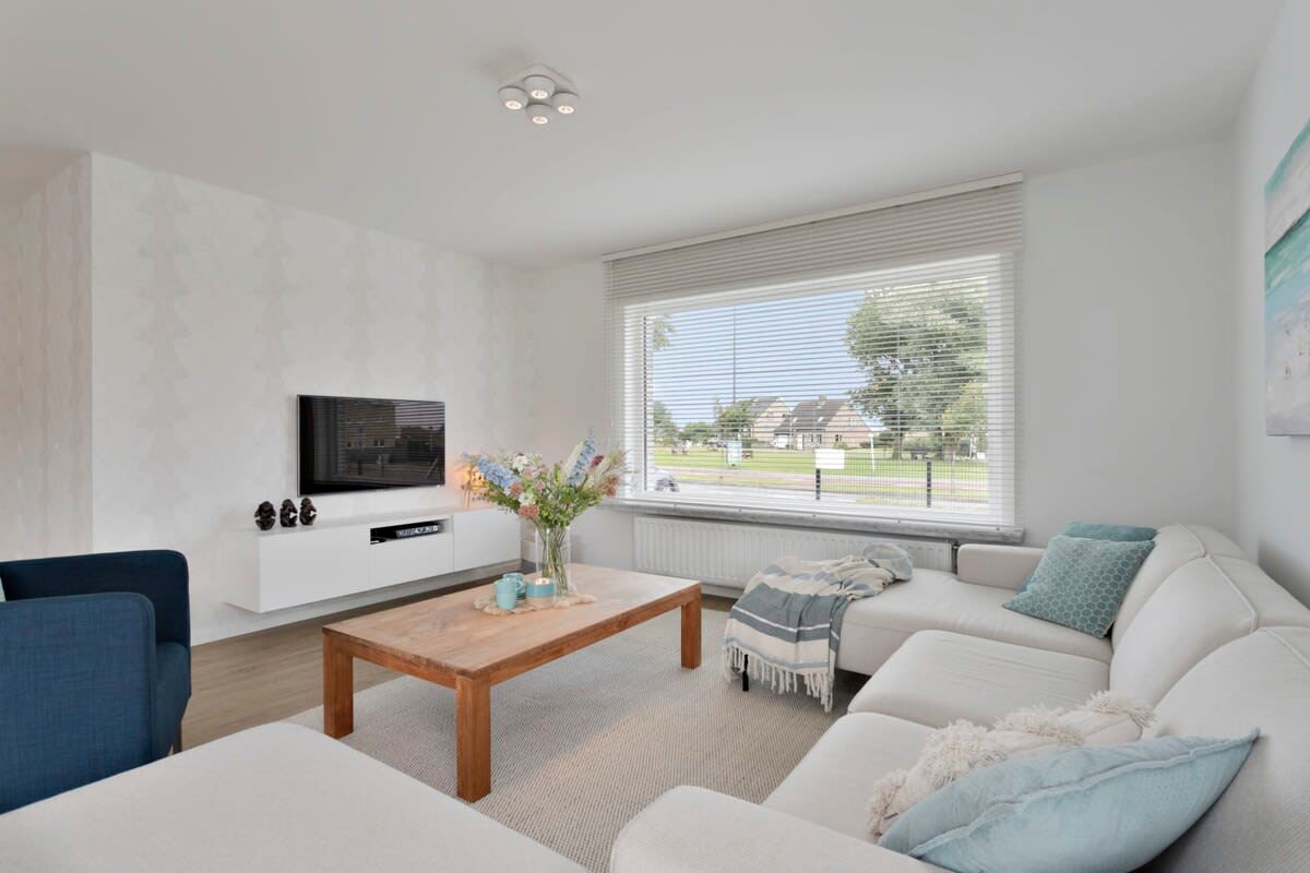 Bright and spacious living room with dining area