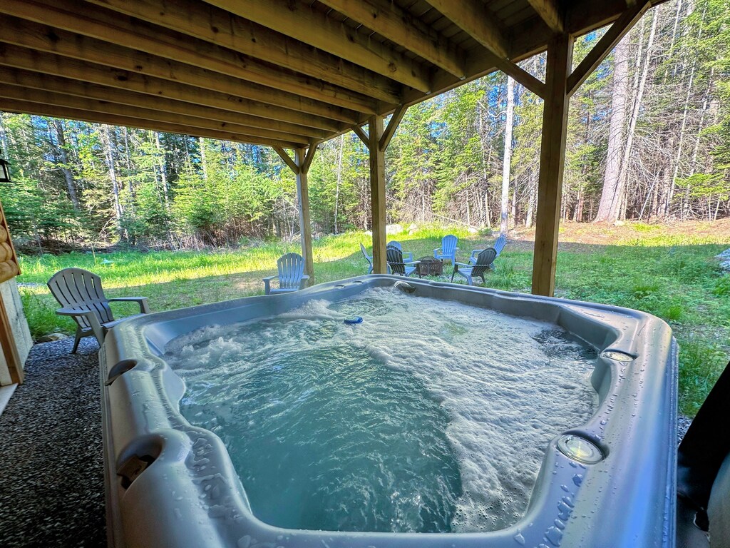 Back yard offers a fire pit and hot tub