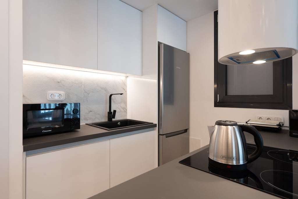 This gorgeous kitchen is fully equipped with all the essentials for a home-like stay