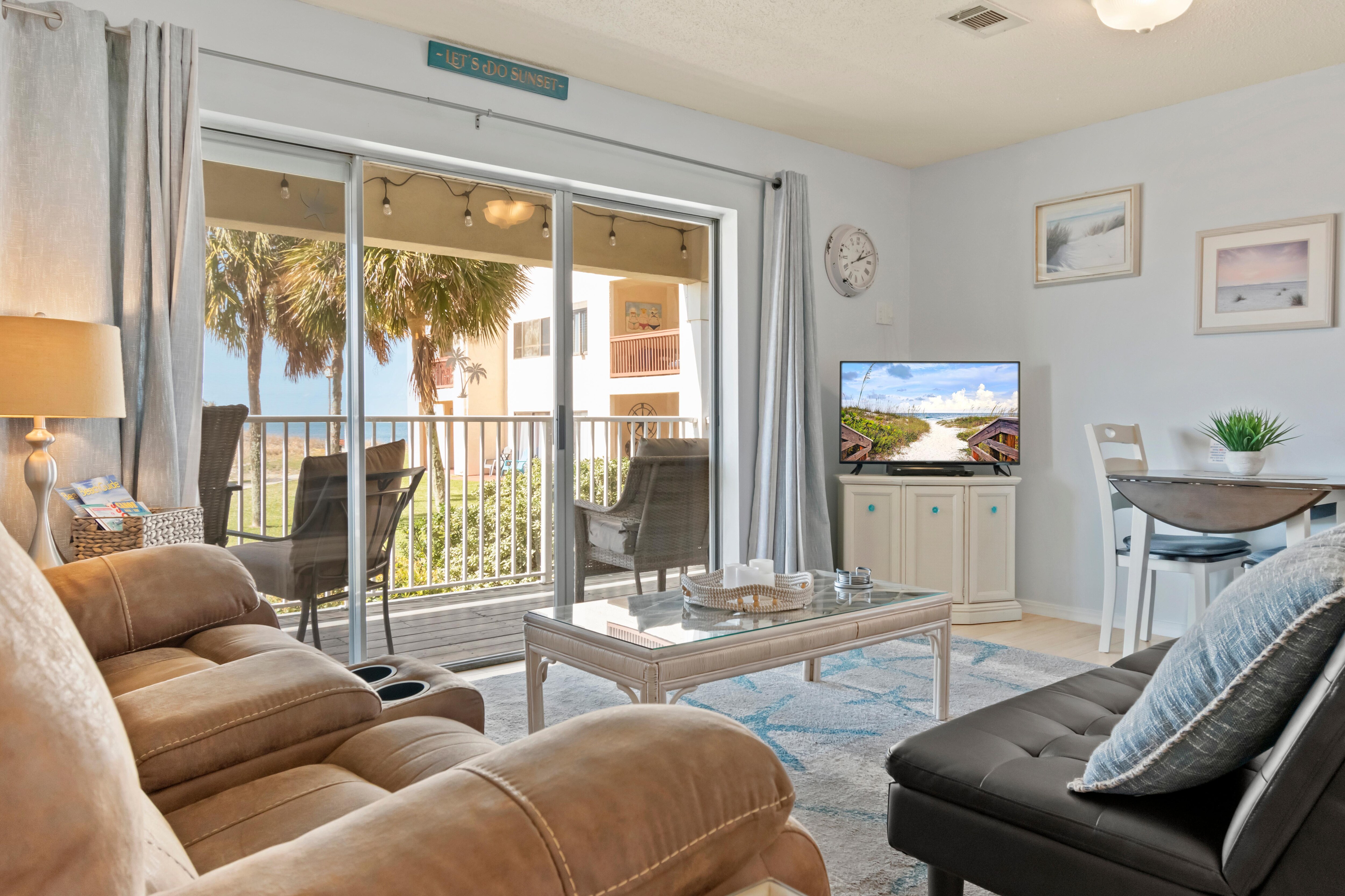 Open and airy living area with sliders out to a private balcony