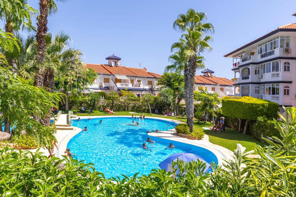 Step into your oasis of relaxation: Open space, a swimming pool, and nature's embrace.