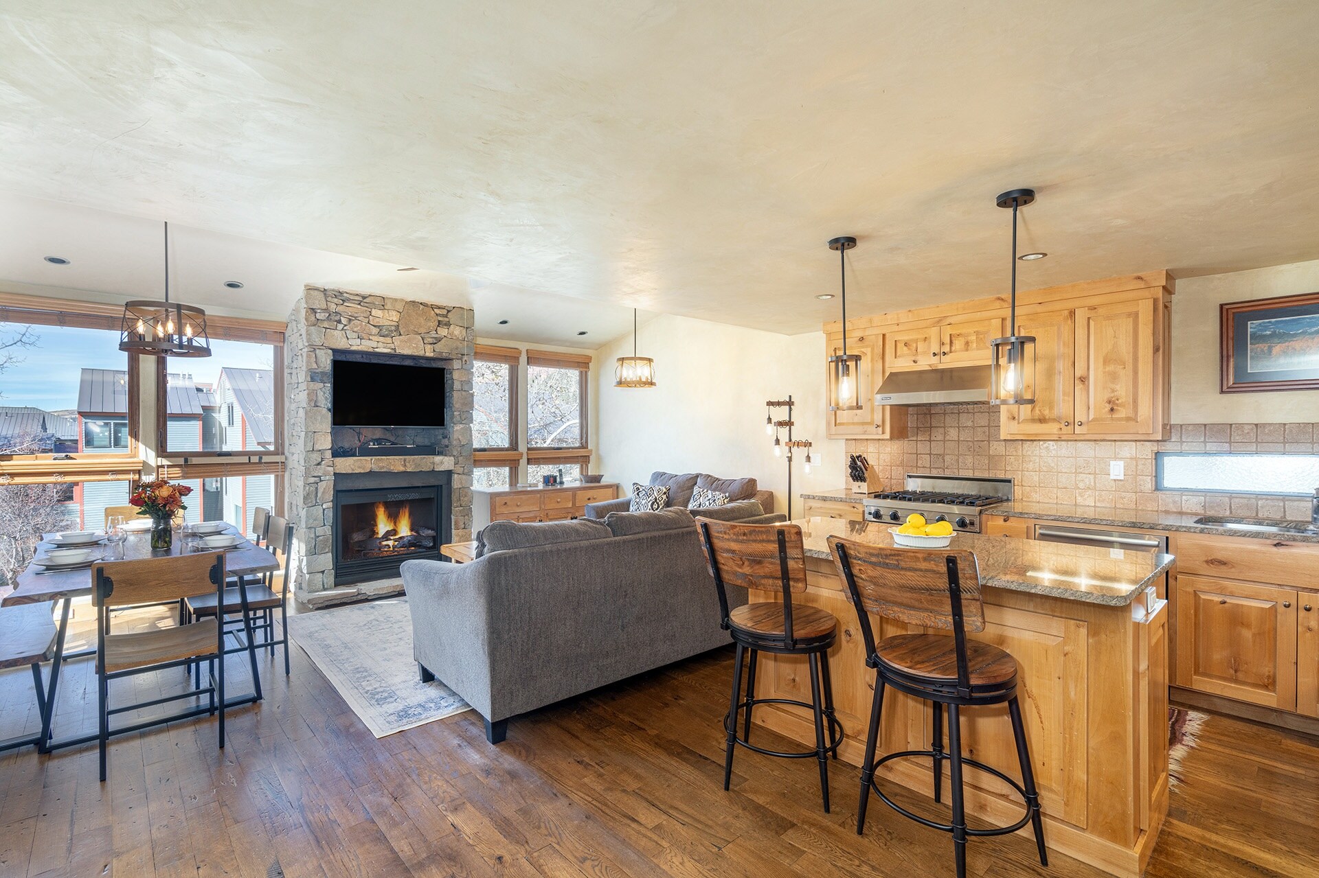 Telluride Lodge 326 offers an open, contemporary living room/kitchen area with a gas fireplace.