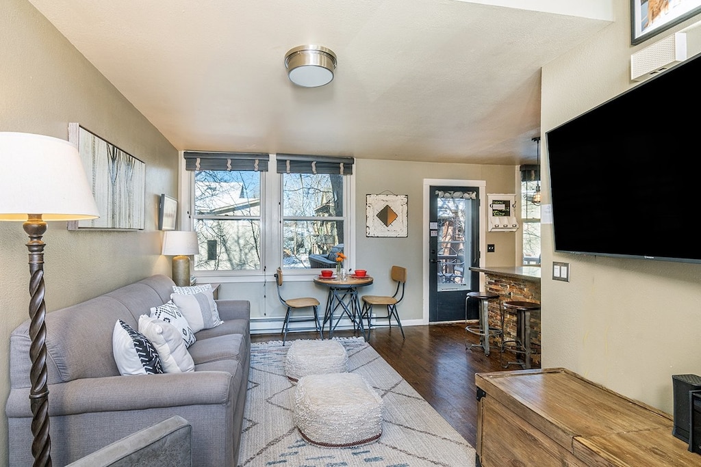 Spacious living and kitchen area that connects to beautiful riverfront deck.