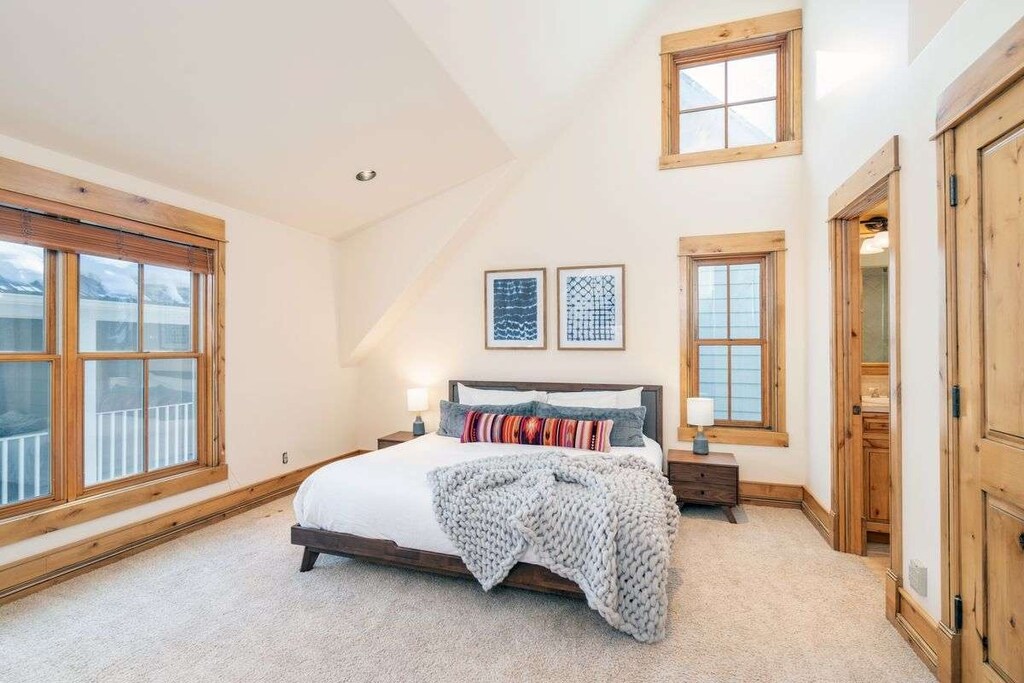 The top floor primary suite is a retreat for anyone in your party who needs a little extra quiet or space