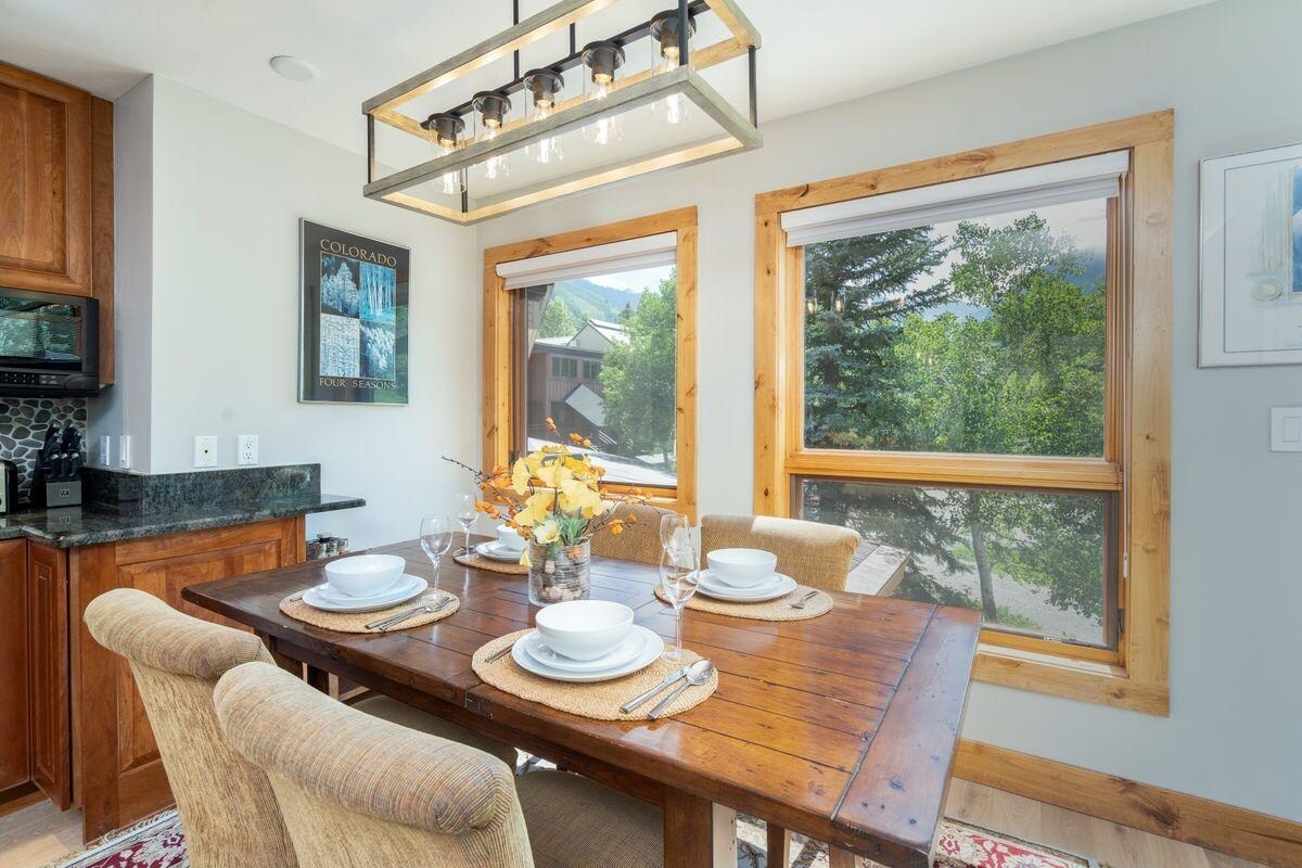 There is a dining table for 4 guests next to the kitchen, overlooking the base of Chair 7.