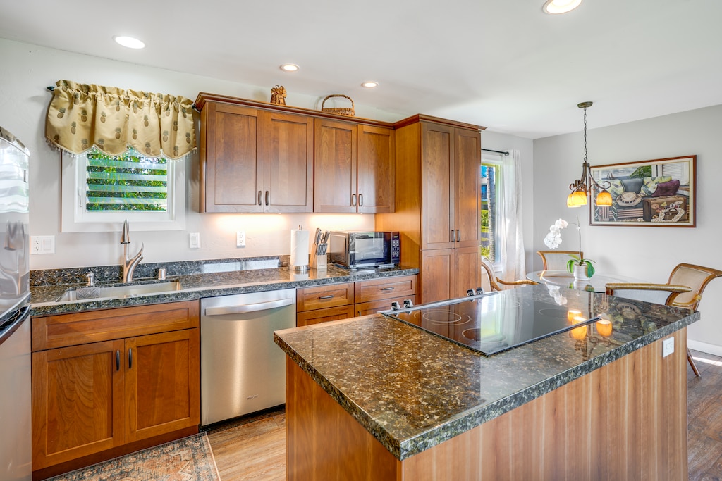 The modern kitchen, open to the living and dining areas, is a culinary delight.