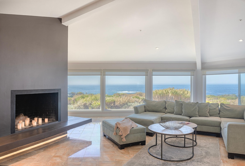 Living Room has a Candlelit Fireplace and Ocean Views