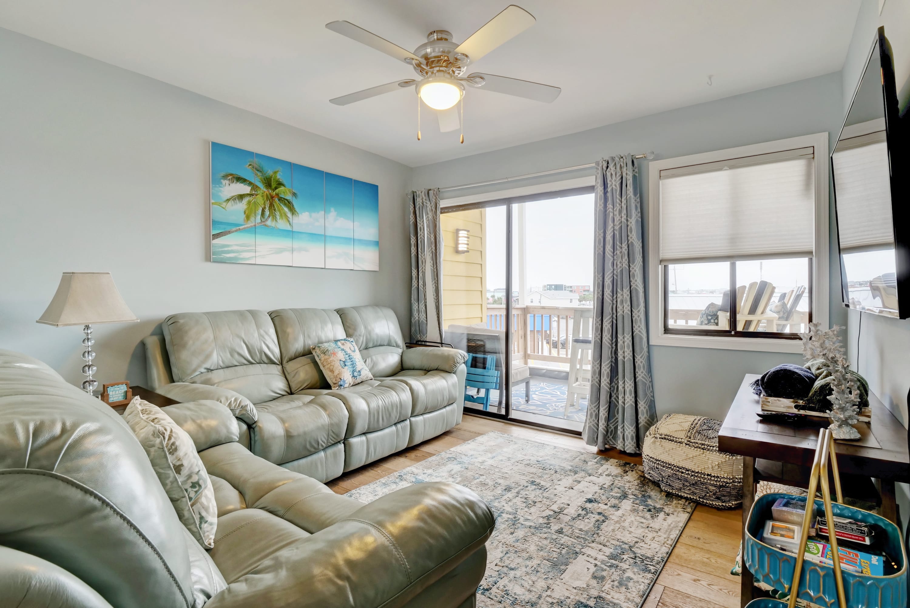 Timeless comfort awaits in this naturally lit living room adorned with a classic-style sofa.