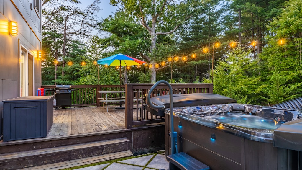 Private oasis with BBQ grill, outdoor dining, and hot tub.
