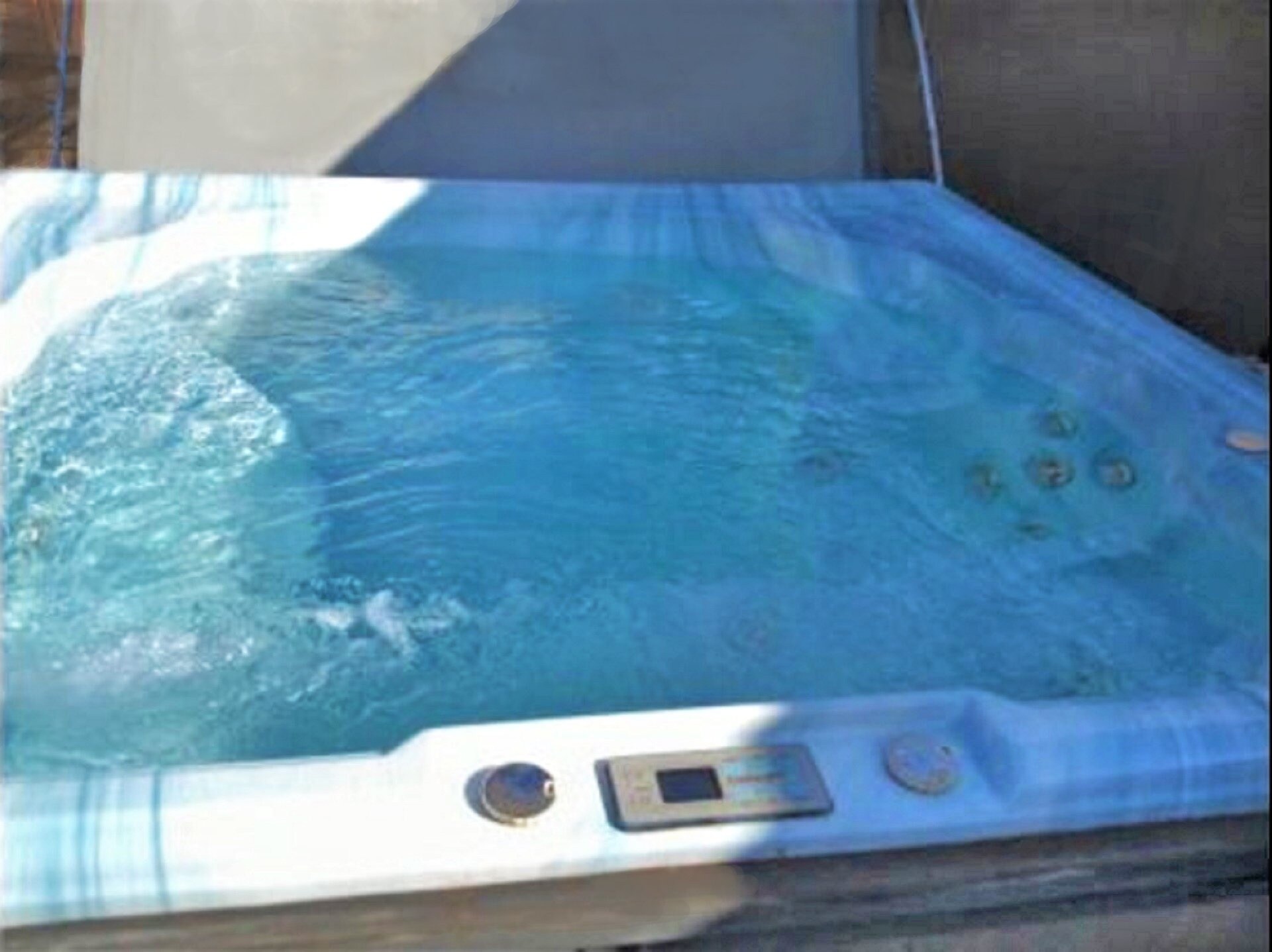 Large hot tub located in the private back yard.