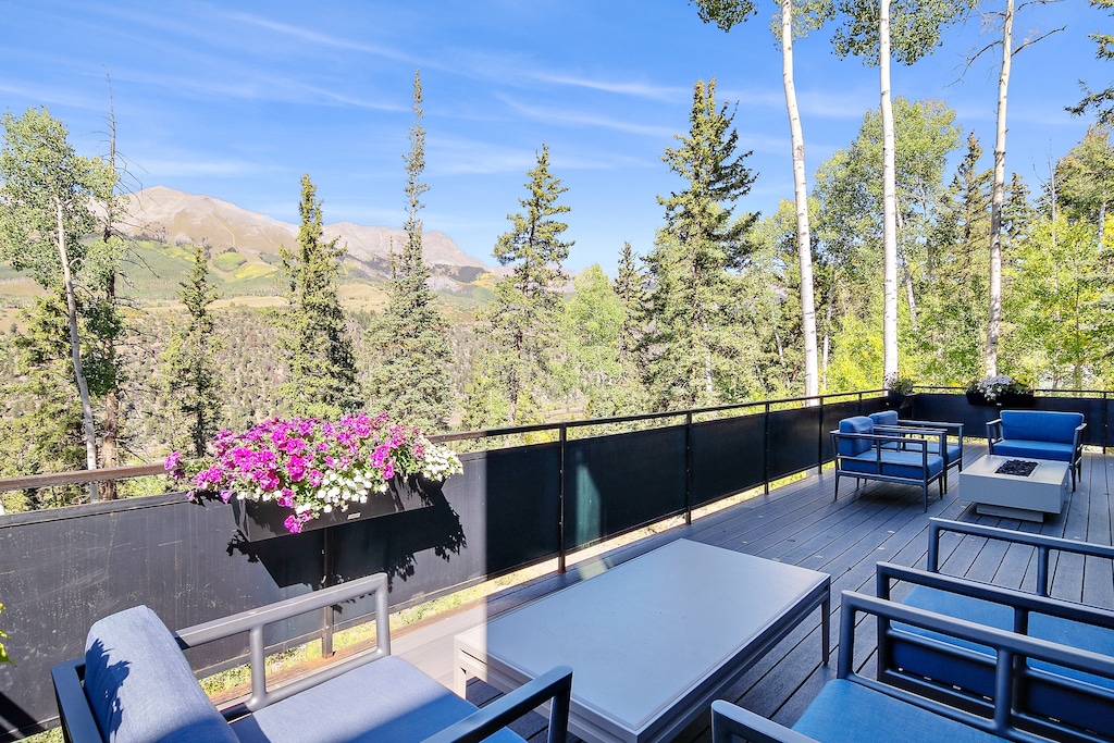 A large and spacious deck offers seating for 8+ as well as a gas fire pit and Gas BBQ grill.