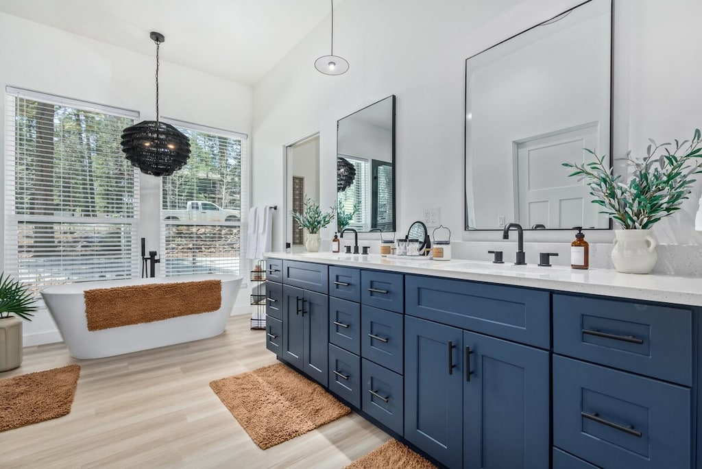Primary en-suite bathroom with dual sink vanity