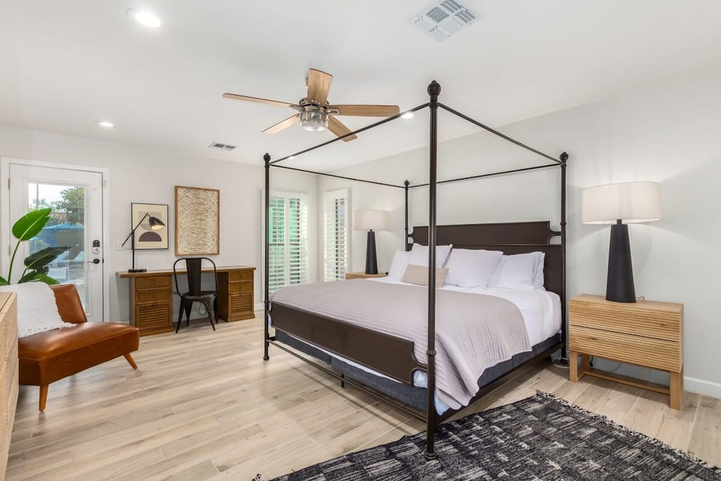 Primary Suite 1 with King bed, workspace and back yard access