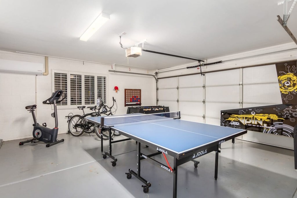 Huge game room with table tennis, exercise bike, bicycles and arcade games