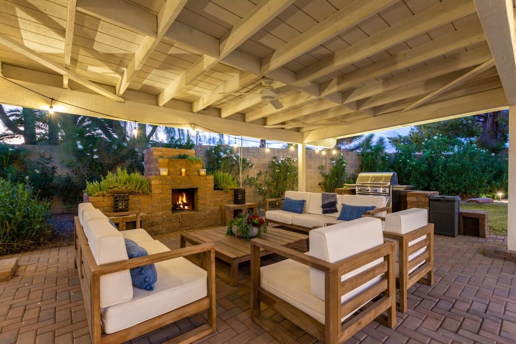 Cozy up in the private ramada with plenty of seating + BBQ