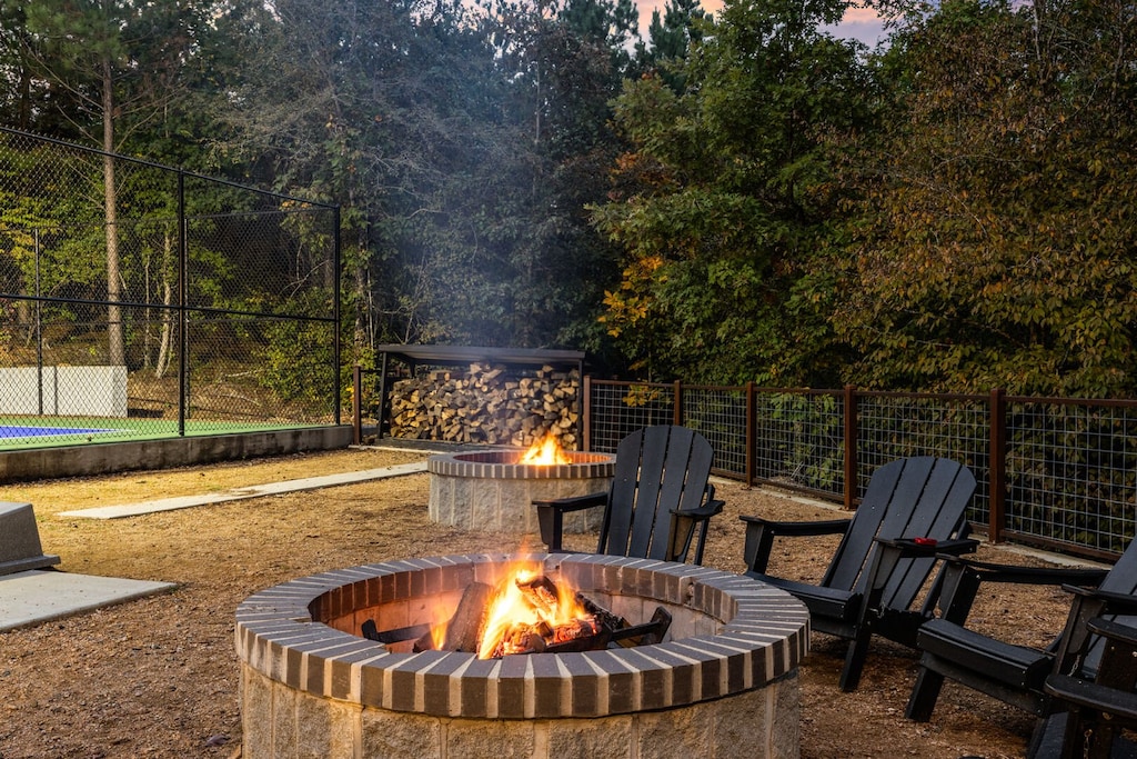 Outdoor firepit beside sports court.