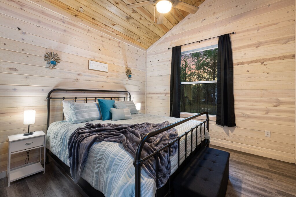 Queen bed upstairs by game area