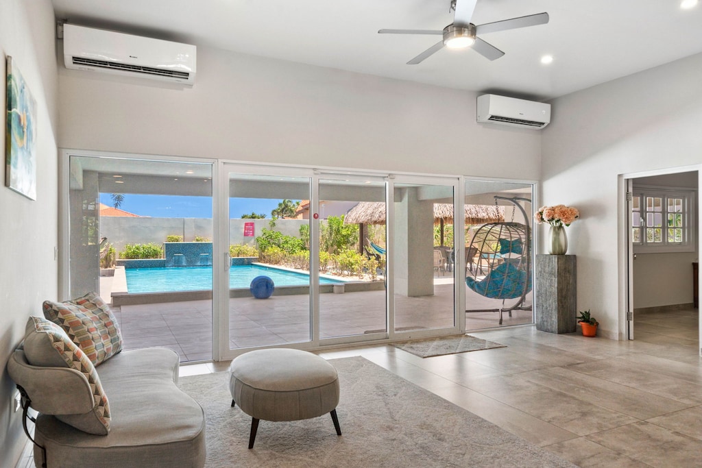 Cozy seating area with glass sliding door to the backyard.