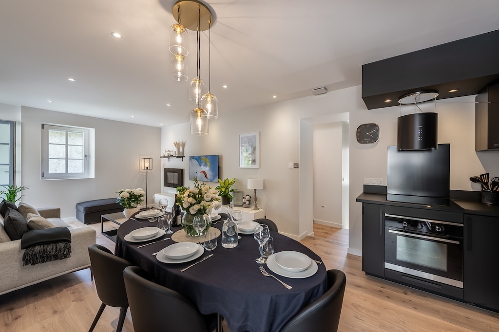 Dining room with open kitchen overlooking the living room.