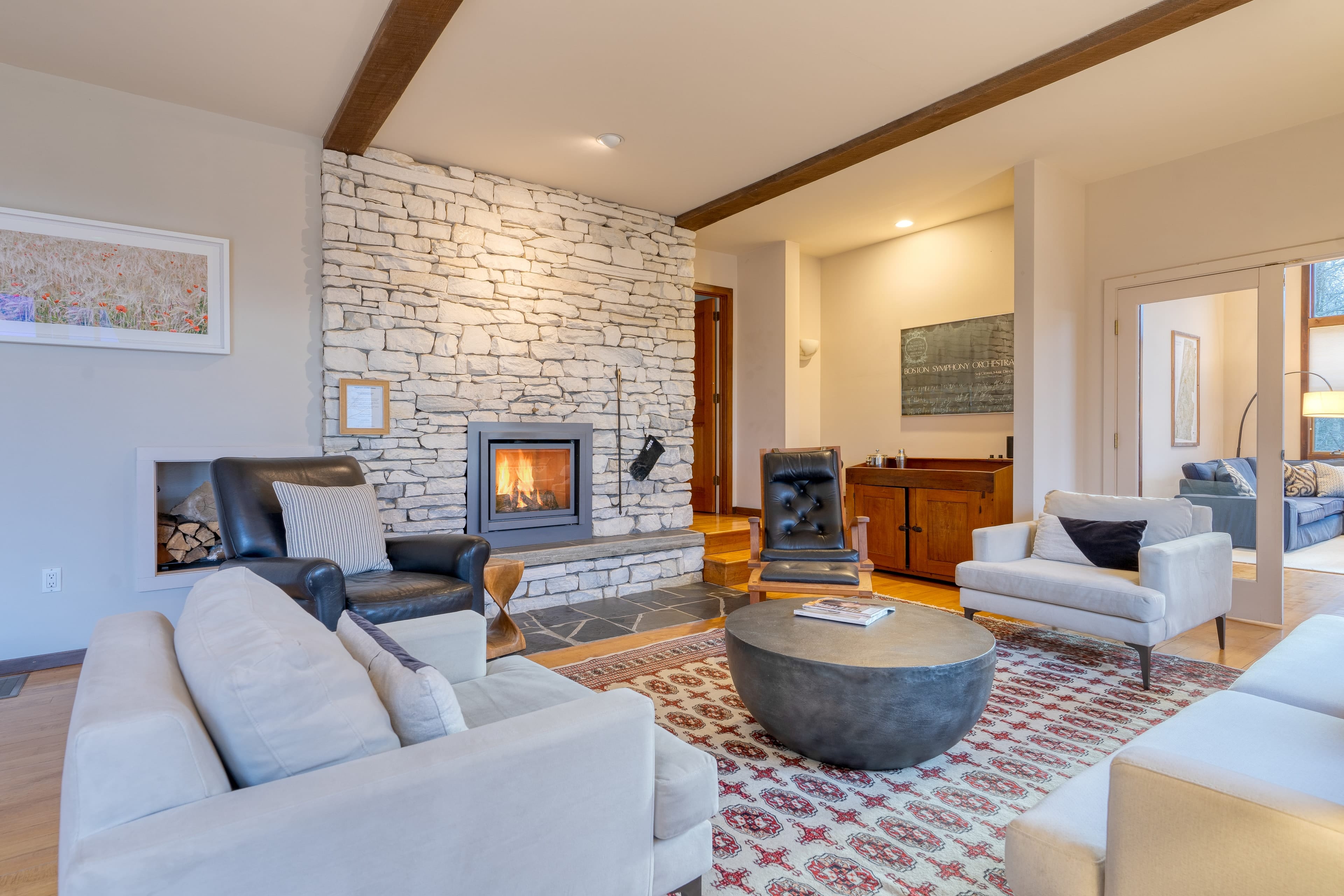 Cozy elegance: A living room centered around a warm, inviting fireplace.