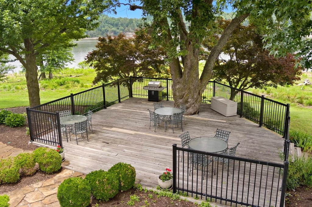 On our large, private deck you'll find three four-top dining tables and a propane grill.