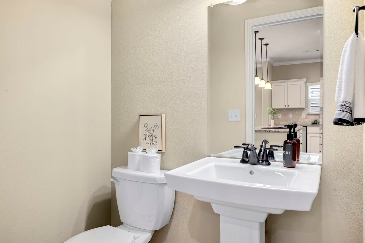 Our half bathroom can be found off the living room.