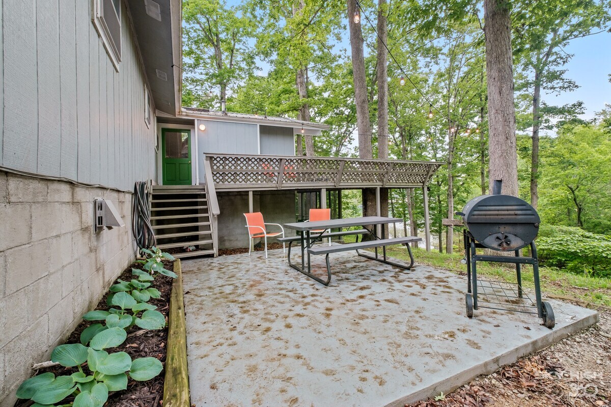 Head down the deck stairs and you'll enter into our BBQ area, complete with a picnic table, seating area and grill.